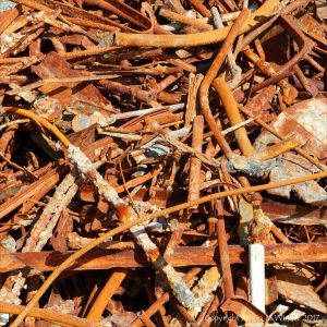 Pile of rusty metal junk on the beach