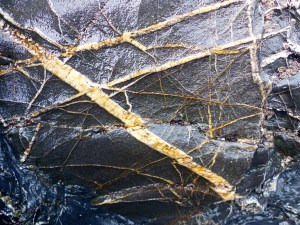 Pattern and texture in slate rock on the beach at Polurrian Cove