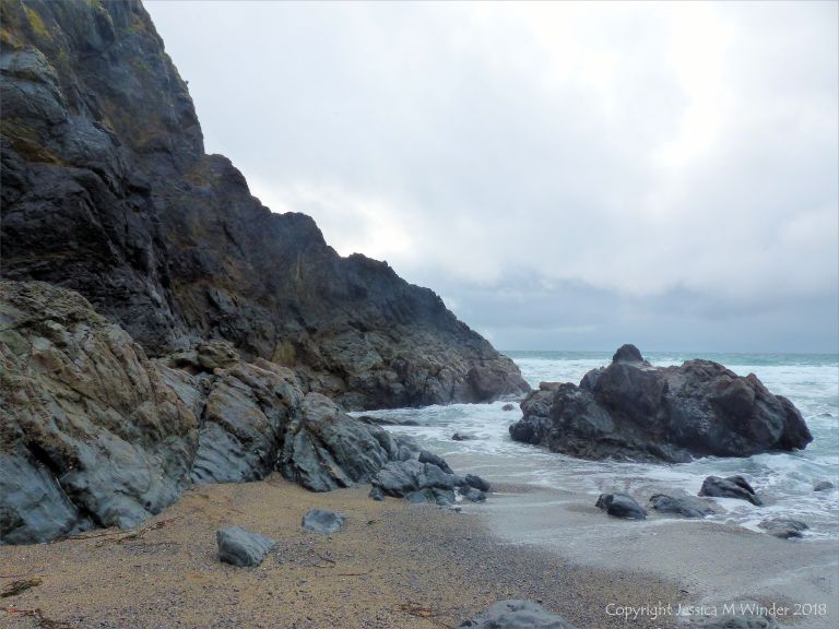 View of the Traboe Formation rocks with hornblende schist on the south side of Polurrian Cove in Cornwall