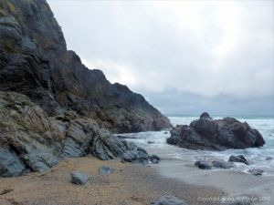 View of the Traboe Formation rocks with hornblende schist on the south side of Polurrian Cove in Cornwall
