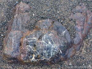 Rock outcrop on the beach at Polurrian Cove