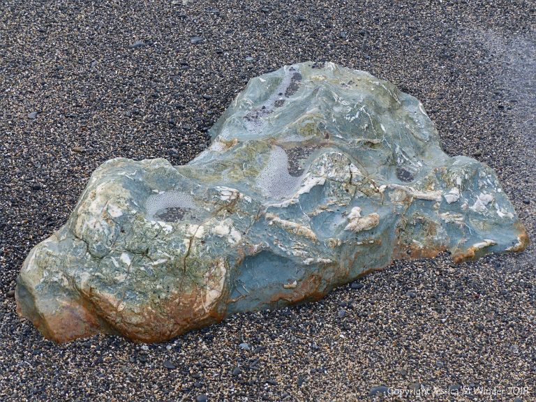 Rock outcrop on beach at Polurrian Cove
