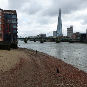 View looking east from the foreshore on the north bank of the Thames near the Millennium Bridge.