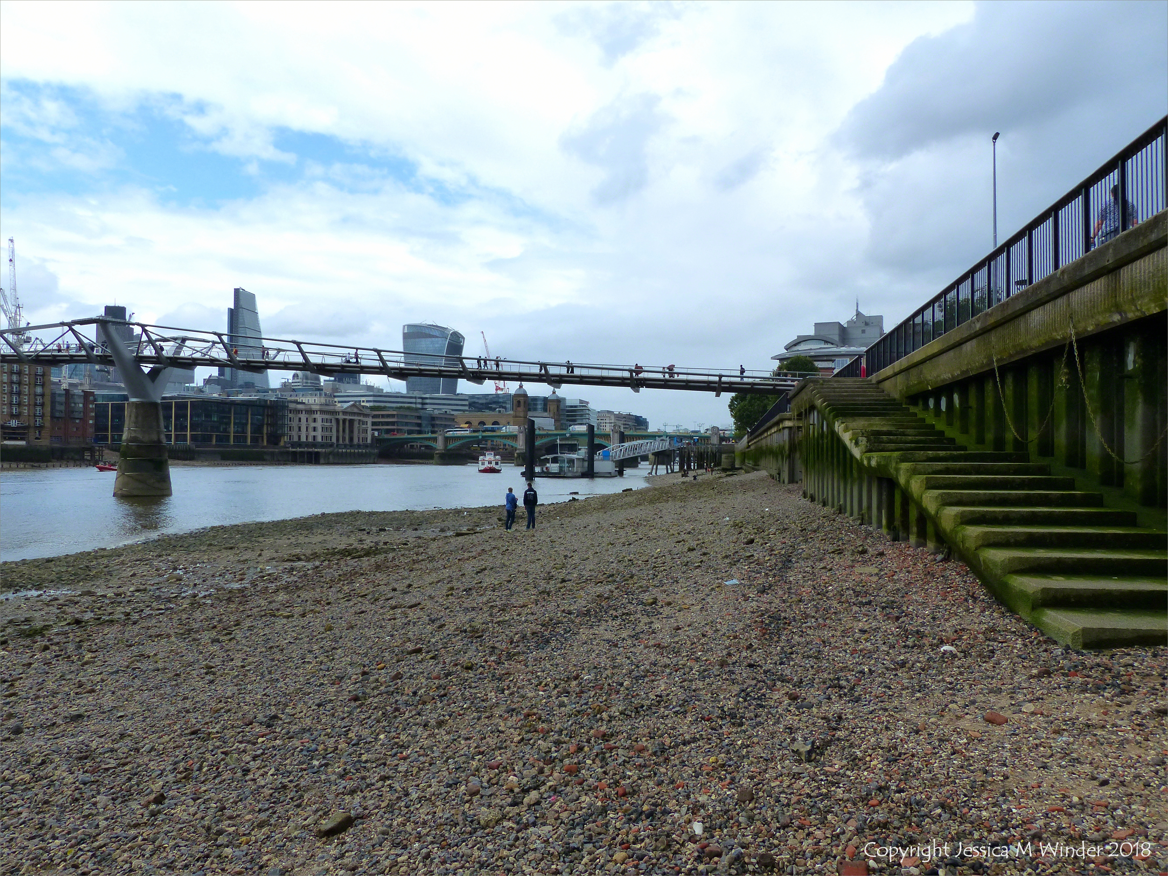 View of the Thames foreshore at low tide from the South Bank in London