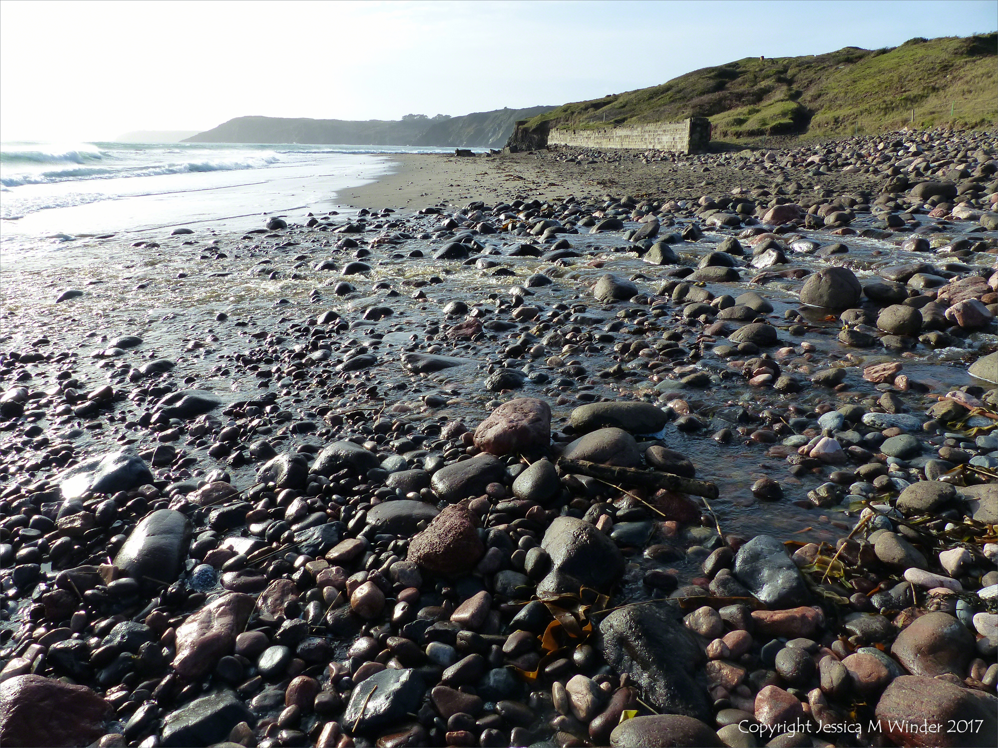 Stream flowing across the beach at Kennack Sands
