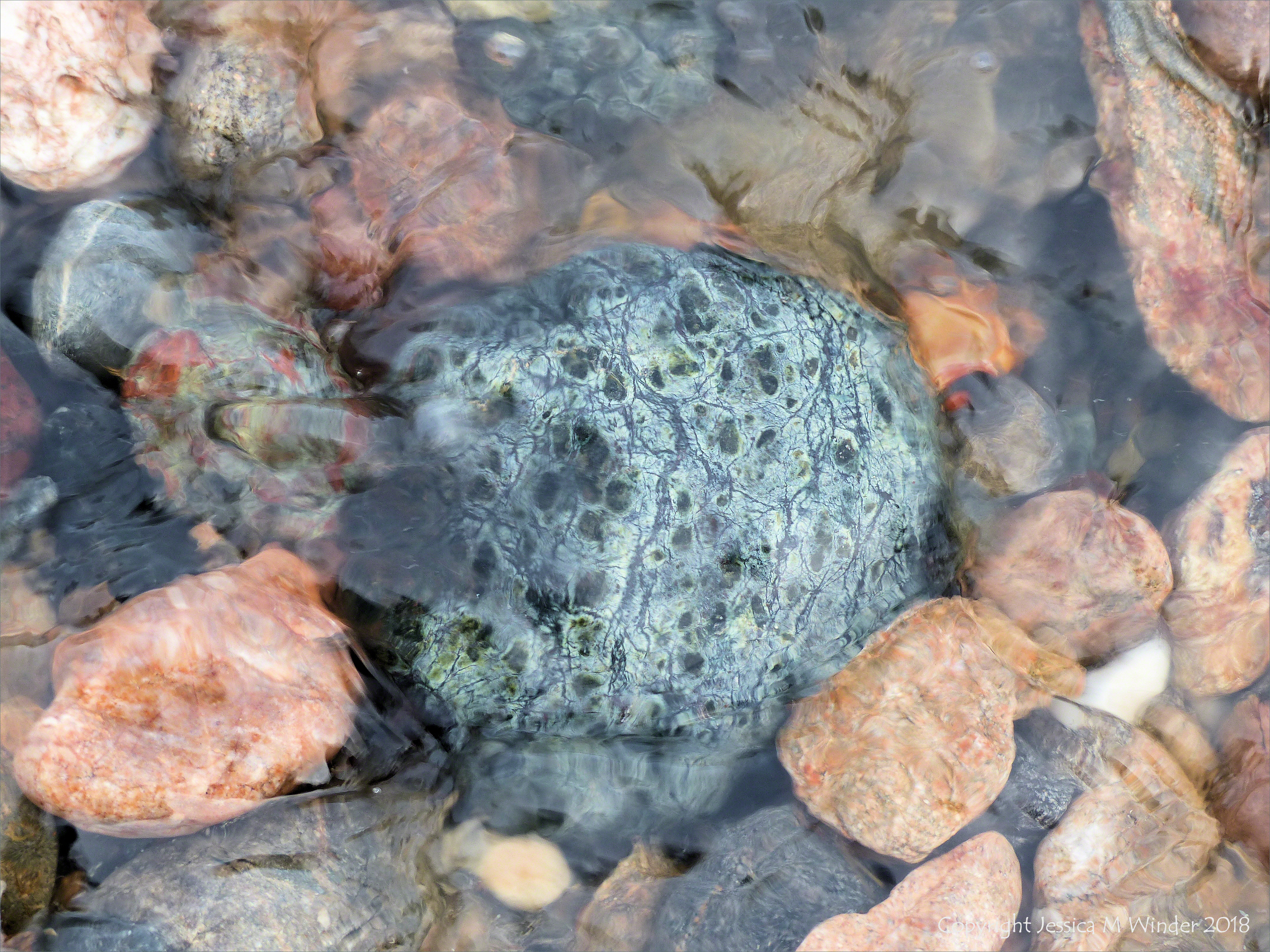 Pebbles in a beach stream at Kennack Sands