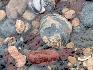Pebbles in a beach stream at Kennack Sands