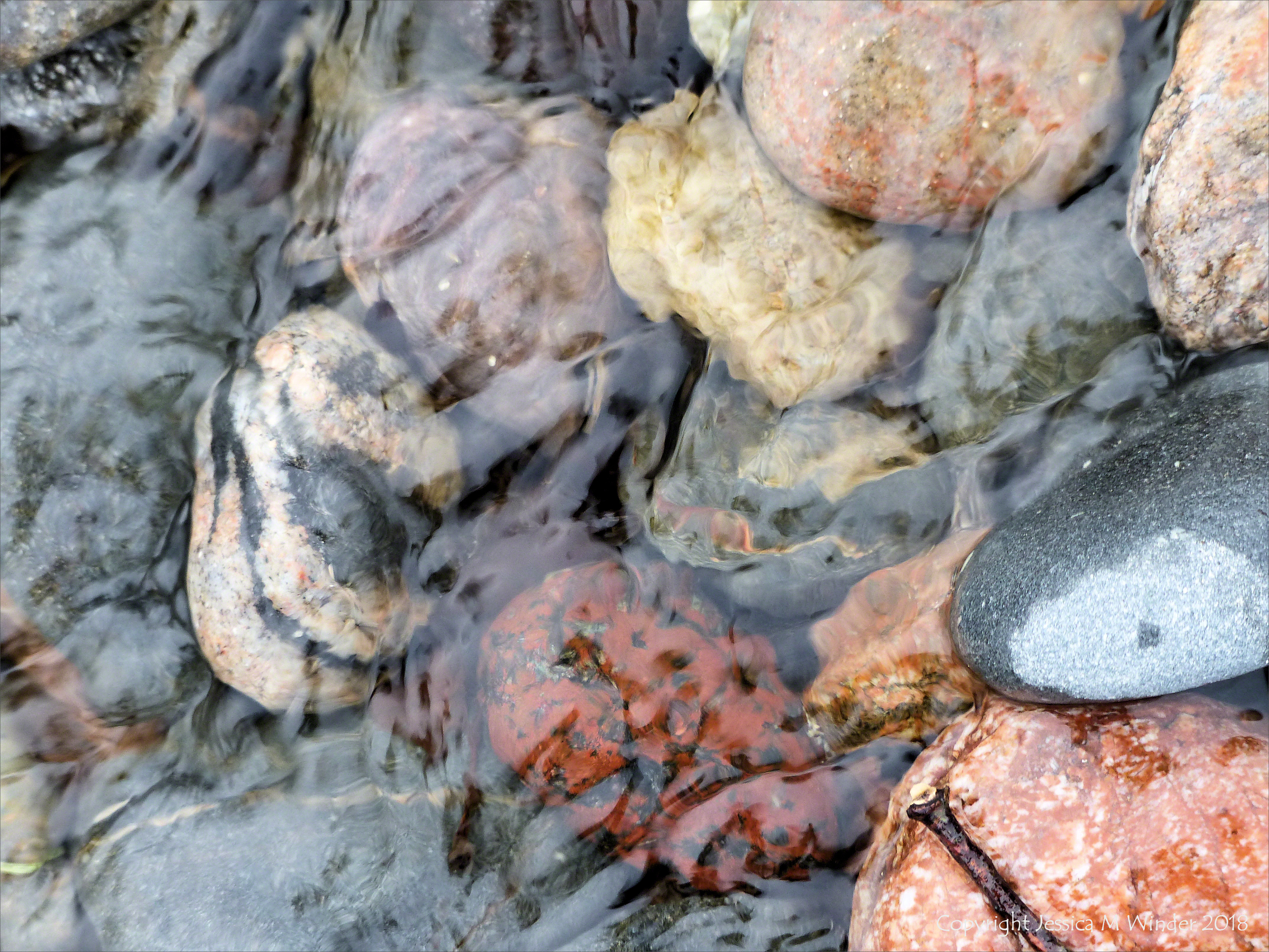Pebbles in a beach stream at Kennack Sands