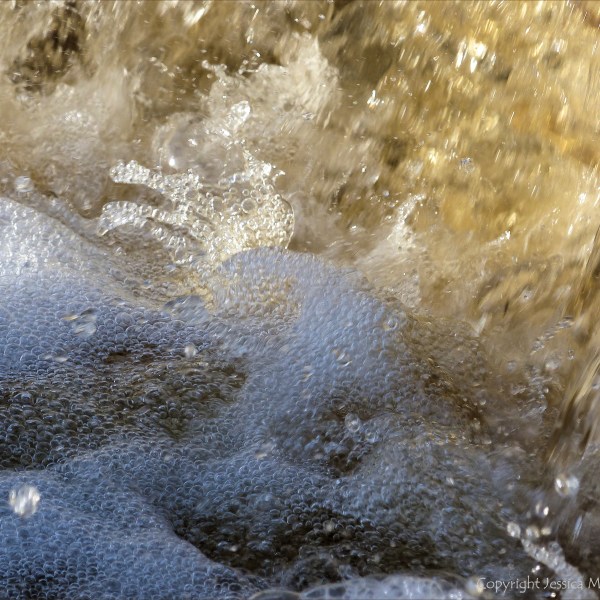 A torrent of water flowing in a Cornish stream