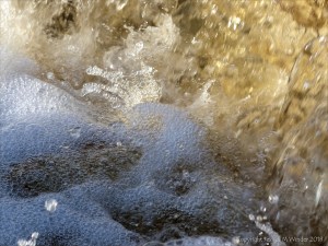 A torrent of water flowing in a Cornish stream