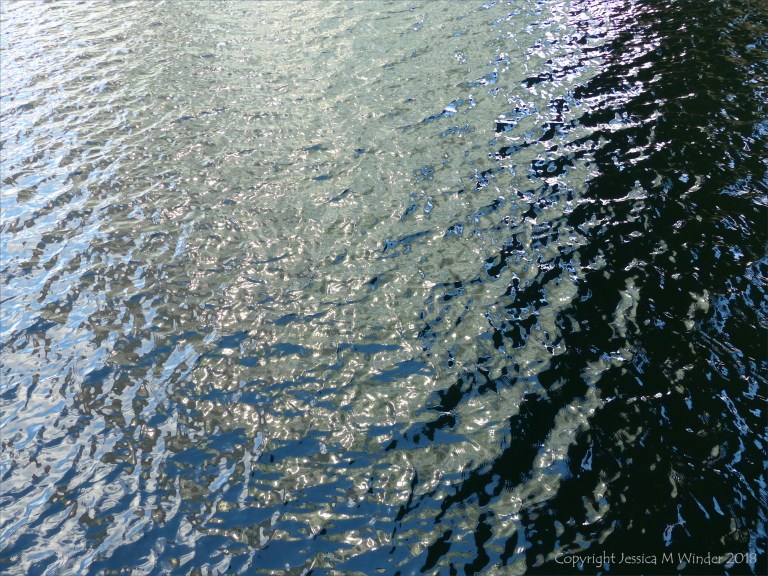 Rippled water with reflected light patterns