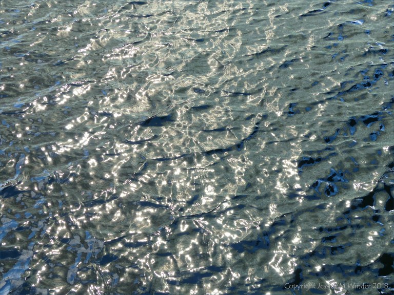 Rippled water with reflected light patterns