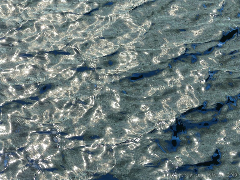 Rippled water with reflected light patterns