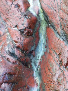 Close-up image red serpentine rock