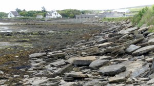 View looking east along the shore at Finstown showing flagstones