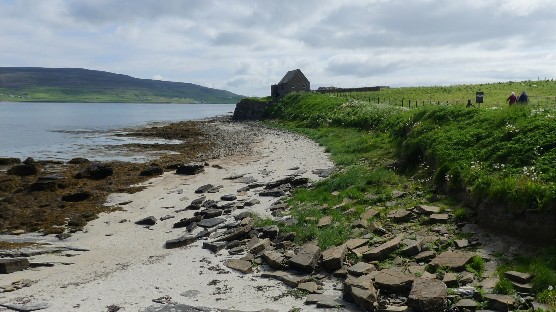 Looking east from Point of Hellia in Orkney towards Broch of Gurness and visitor centre