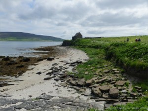 Looking east from Point of Hellia in Orkney towards Broch of Gurness and visitor centre