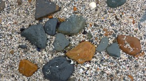Beach stones and shell sand at Birsay causeway