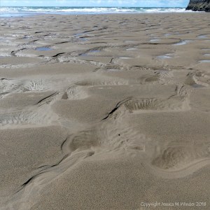 Mega ripples with hollows in wet sand