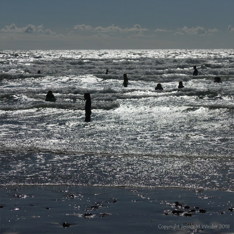 Seaside scene with swimmers