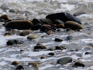 Wave-washed pebbles on the water's edge