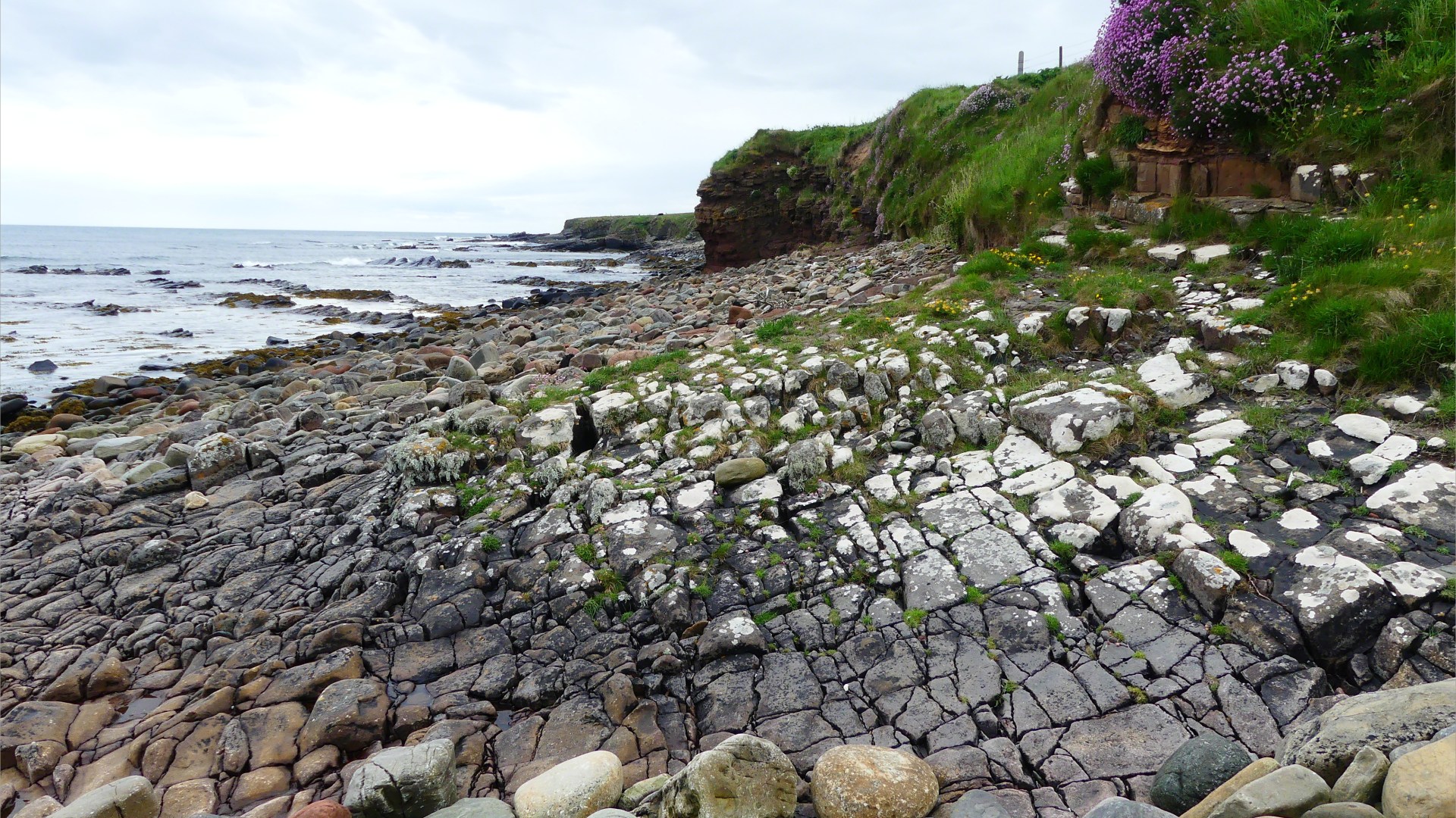 Cracked rock pavement on seashore