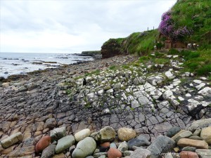 Cracked rock pavement on seashore