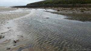 River flowing across the beach at Waulkmill Bay in Orkney