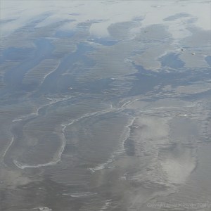 The sandy beach at low tide on Rhossili Bay