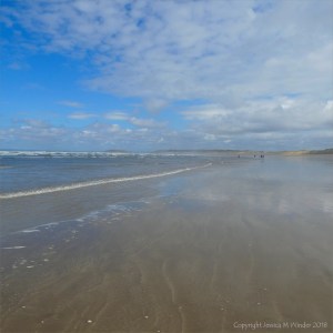 The sandy beach at low tide on Rhossili Bay