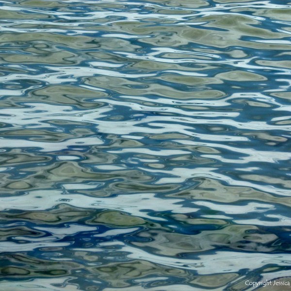 Natural patterns of reflected light on the surface of calm sea water