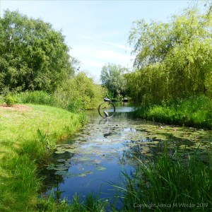 View of lake and sculpture