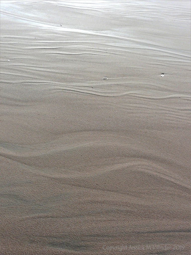 Natural sand texture and pattern on the beach