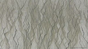 Natural patterns in the sand on a beach as the tide goes out