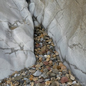Smooth coloured pebbles at Caswell Bay