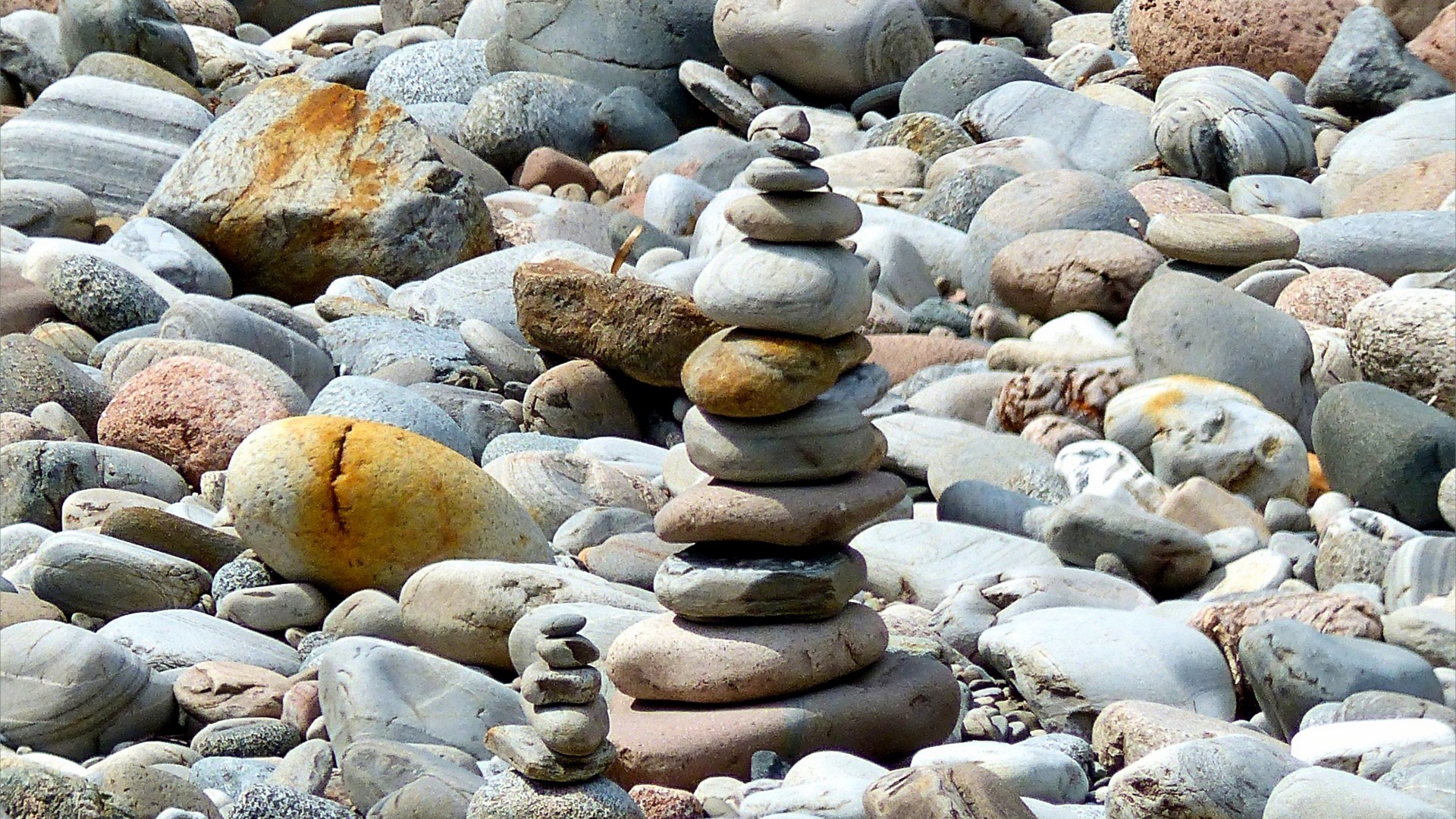 Prbble cairns on a river bank