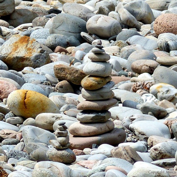 Prbble cairns on a river bank