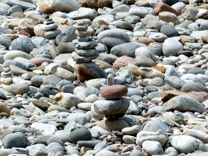 Piles of pebbles by the riverside