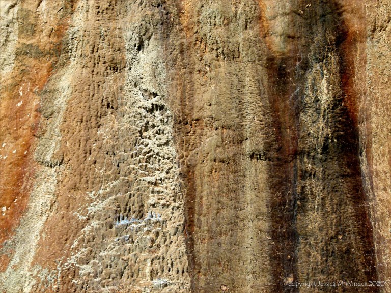 Iron-stained patterns on limestone rocks