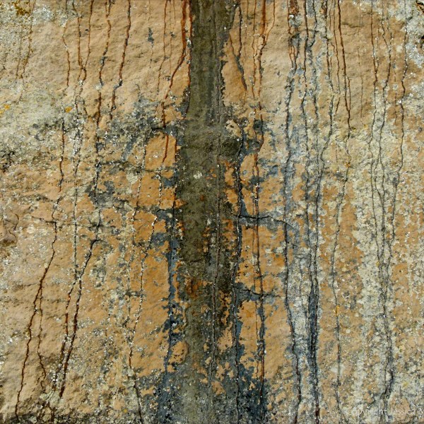 Iron-stained patterns on limestone rocks