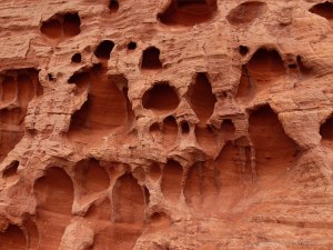 Honeycomb weathering pattern and texture in red rocks