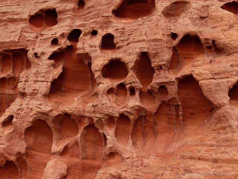 Honeycomb weathering pattern and texture in red rocks