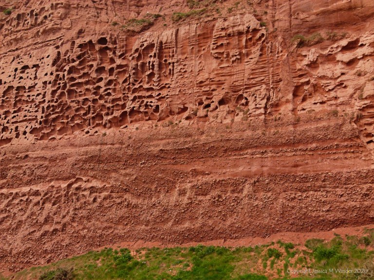 Honeycomb weathering pattern and texture in red rocks