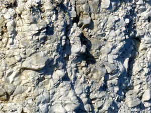 Natural texture of weathered chalk cliff rock