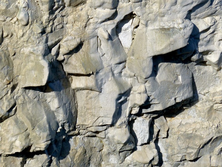 Natural texture of weathered chalk cliff rock