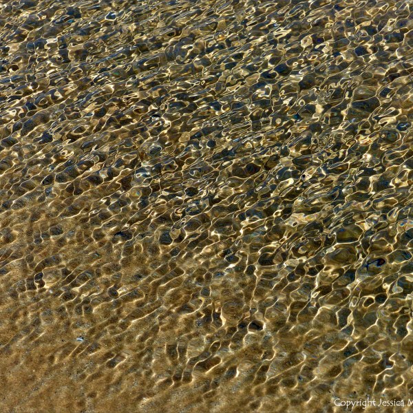 Natural patterns of rippled water with reflected light