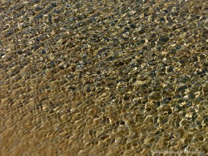 Natural patterns of rippled water with reflected light