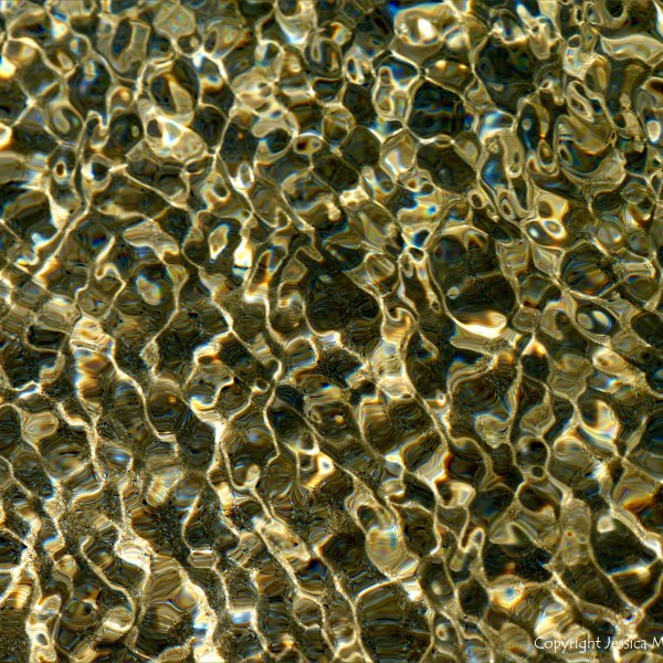 Natural patterns of rippled water with reflected light