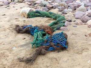 Fishing net washed up as flotsam on the beach