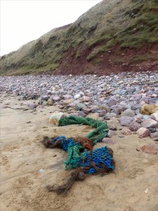 Fishing net washed up as flotsam on the beach